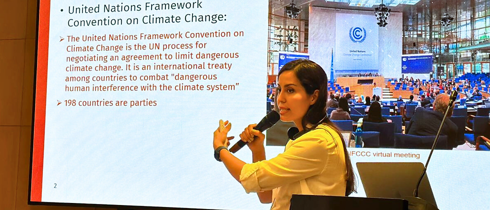 PHOTO: Zainab leads a workshop in Vientiane, presenting on climate-smart agriculture, gender-inclusive strategies, and the role of national policies in climate resilience.